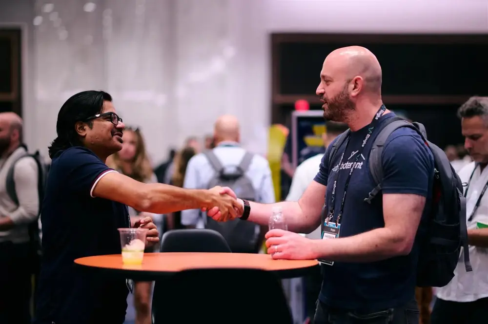 Affiliate Summit West attendees shaking hands